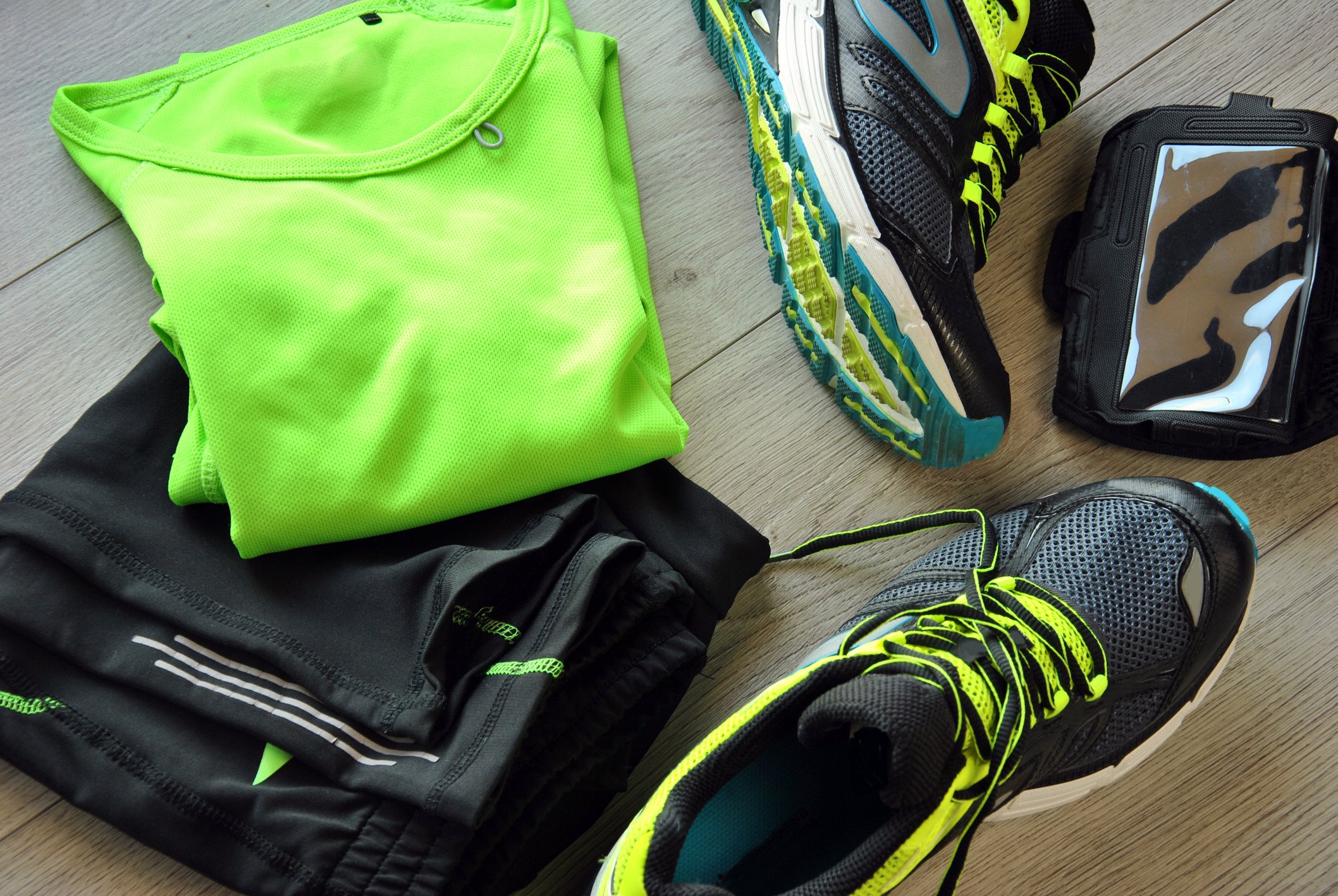 Running gear, including pants, shirt, and shoes.