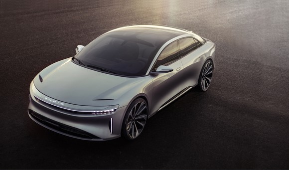 A silver Lucid Air sedan, front and side view.