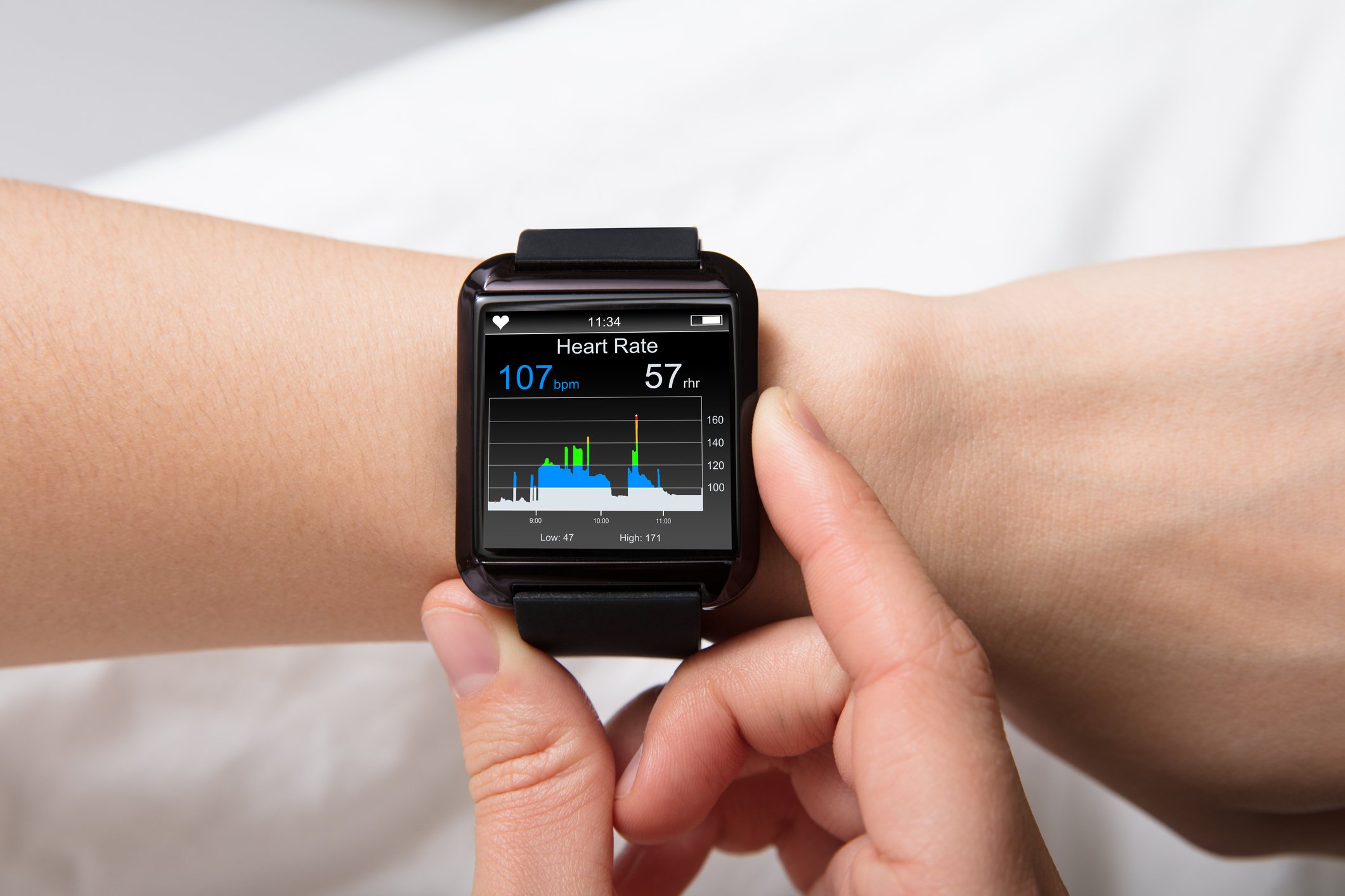 A square smartwatch on a user's wrist.