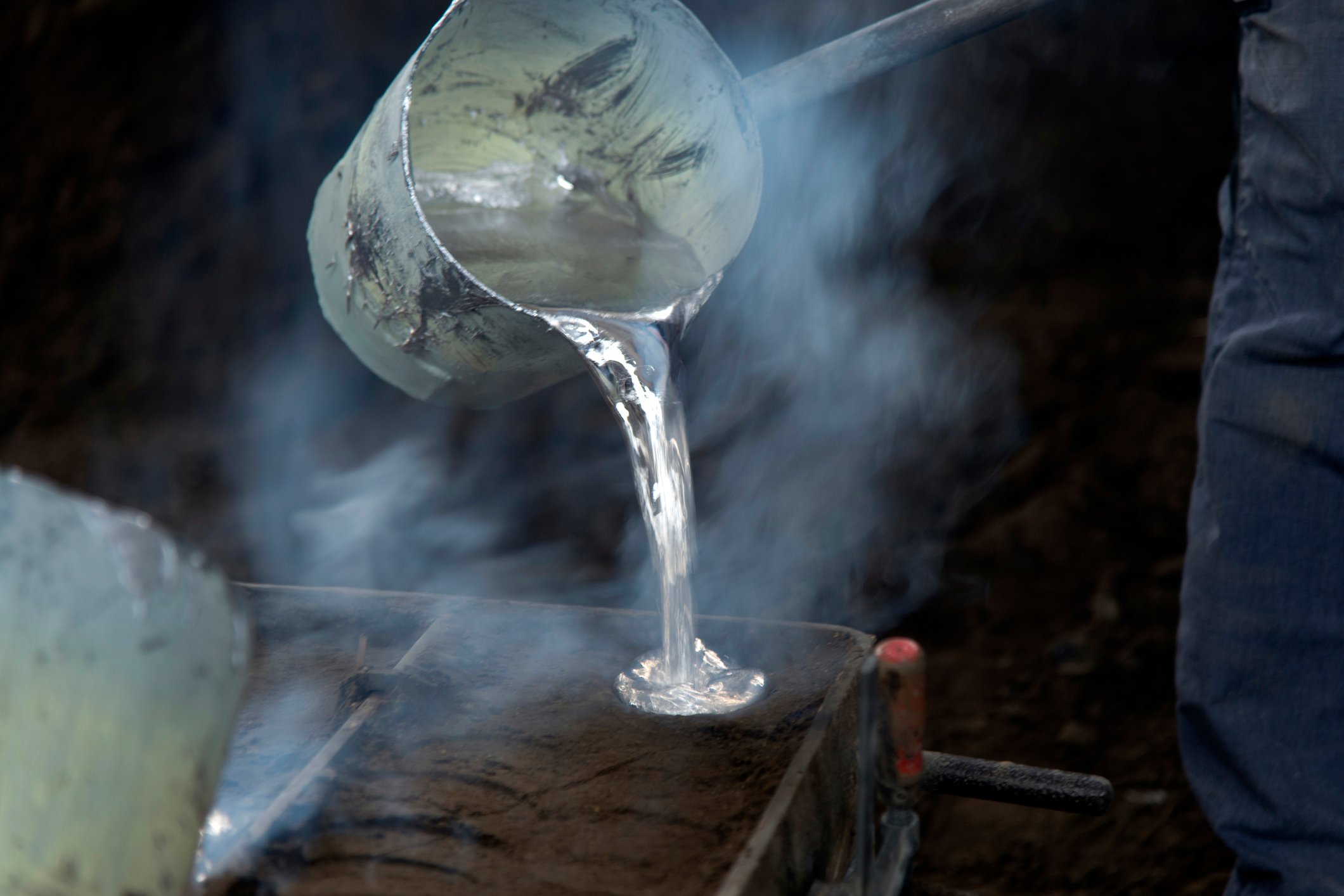 Pouring molten aluminum at a foundry.