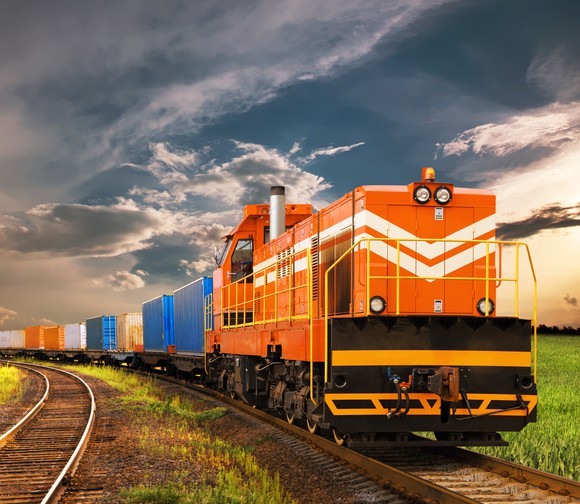An orange train on a track.