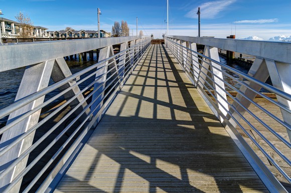 The view from atop a bridge on a sunny day.
