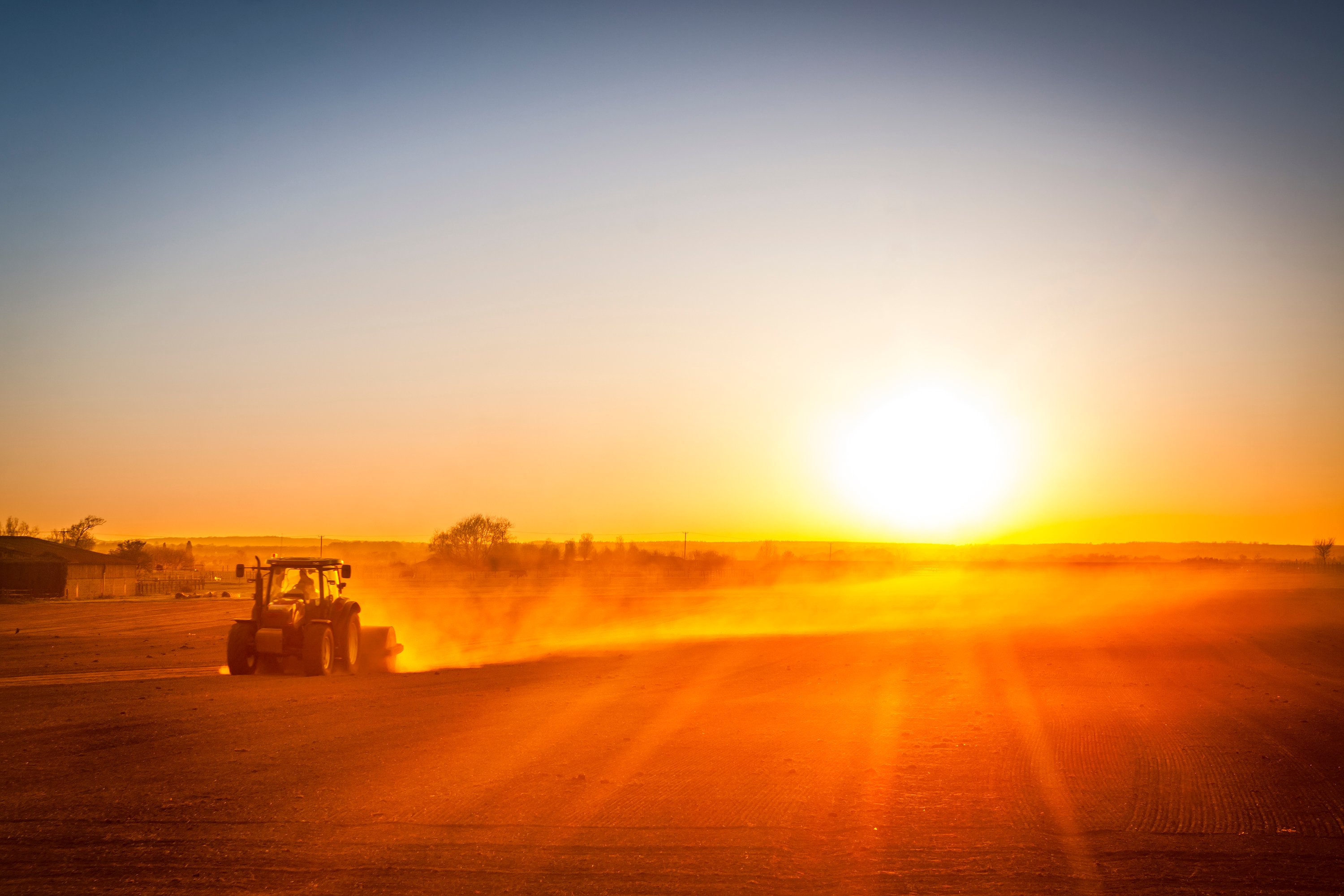 Picture of tractor on farm at sunset