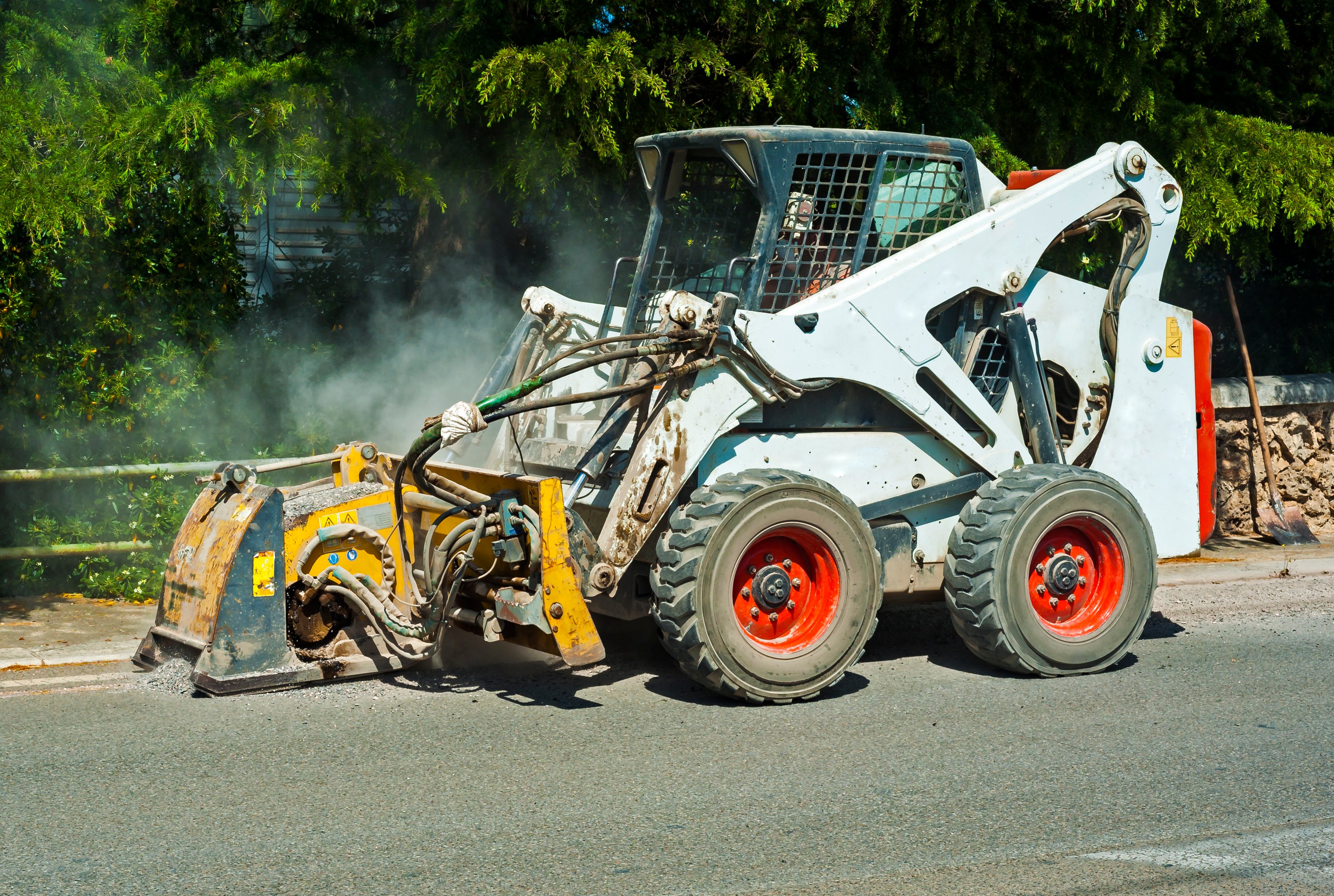 Skid steer at construction site, where United Rentals is a key equipment provider.