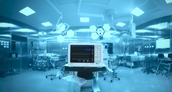 A medical monitor in a hospital room.