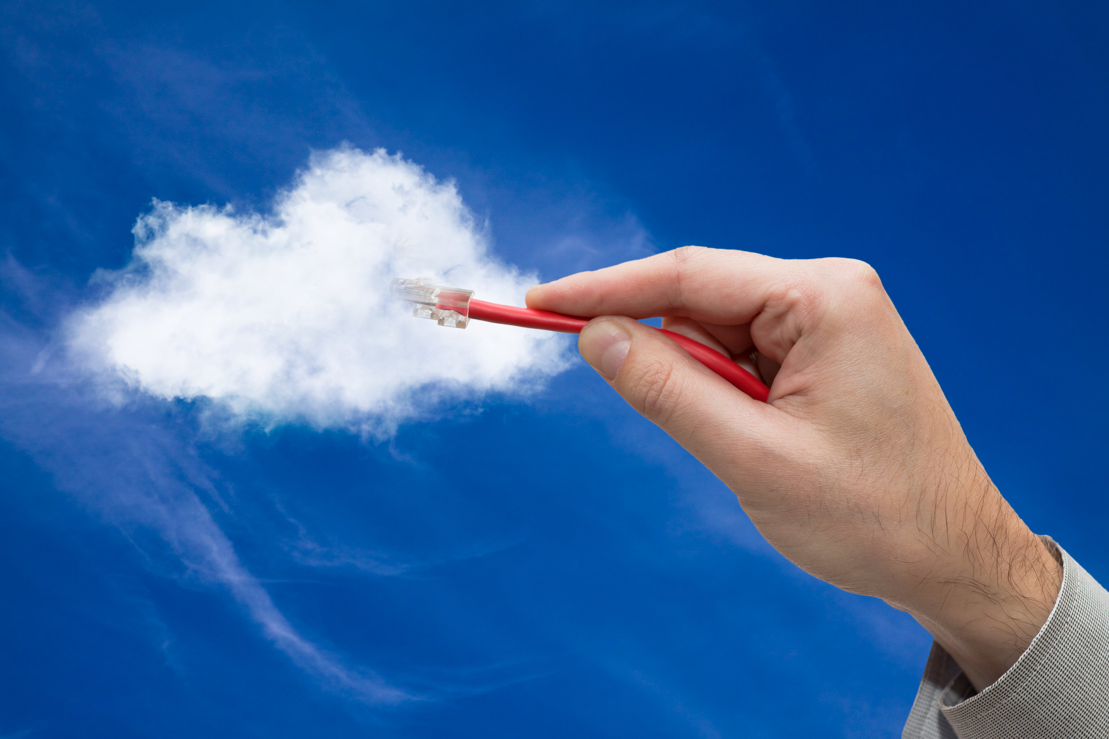 A cable plugging into a cloud.