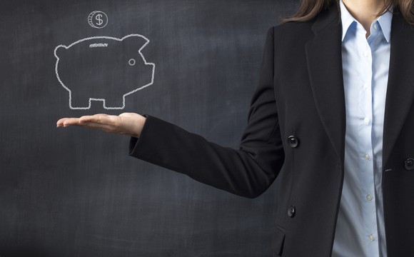 Man holding a piggy bank