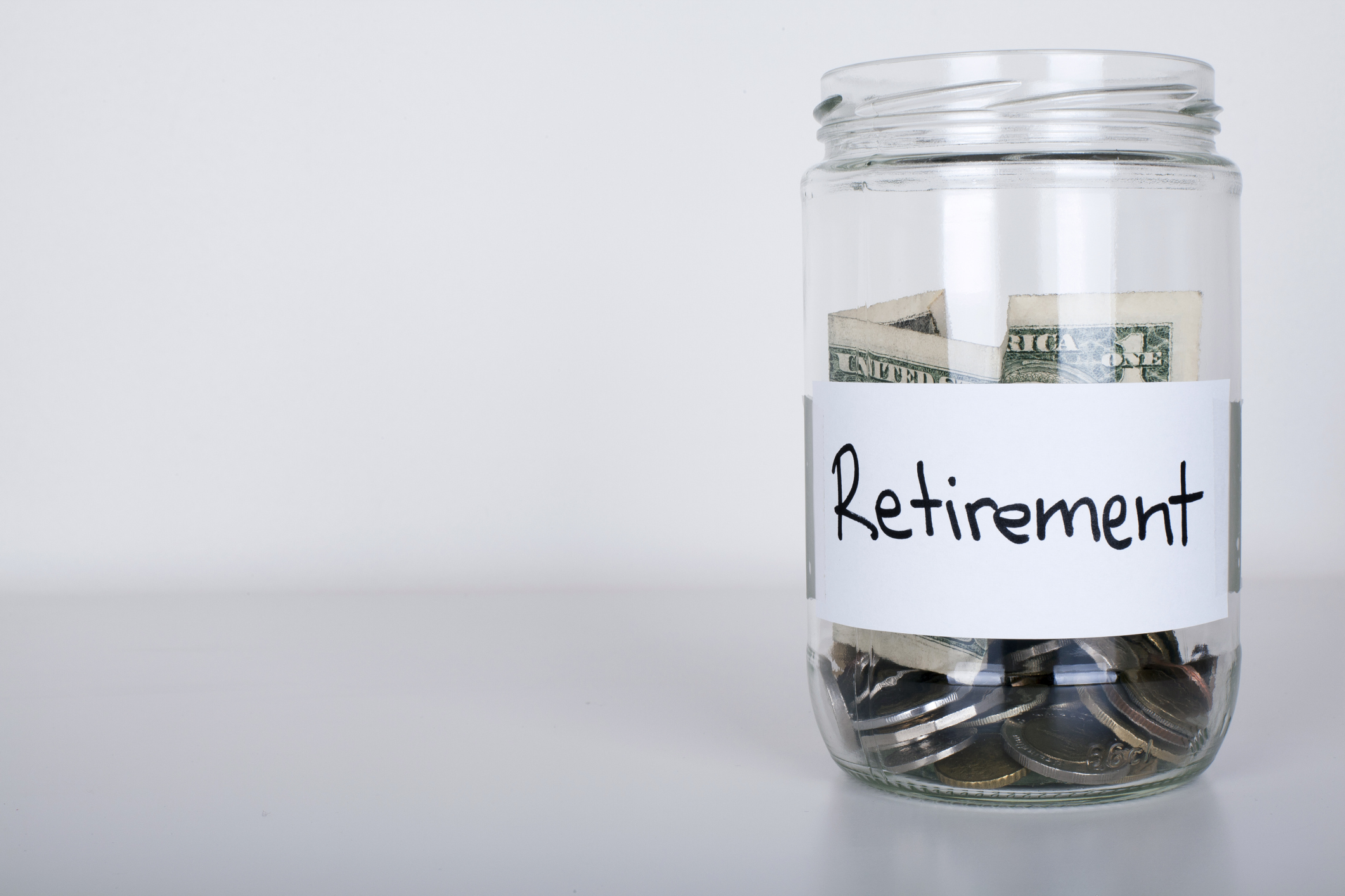 Jar of money labeled as "retirement".