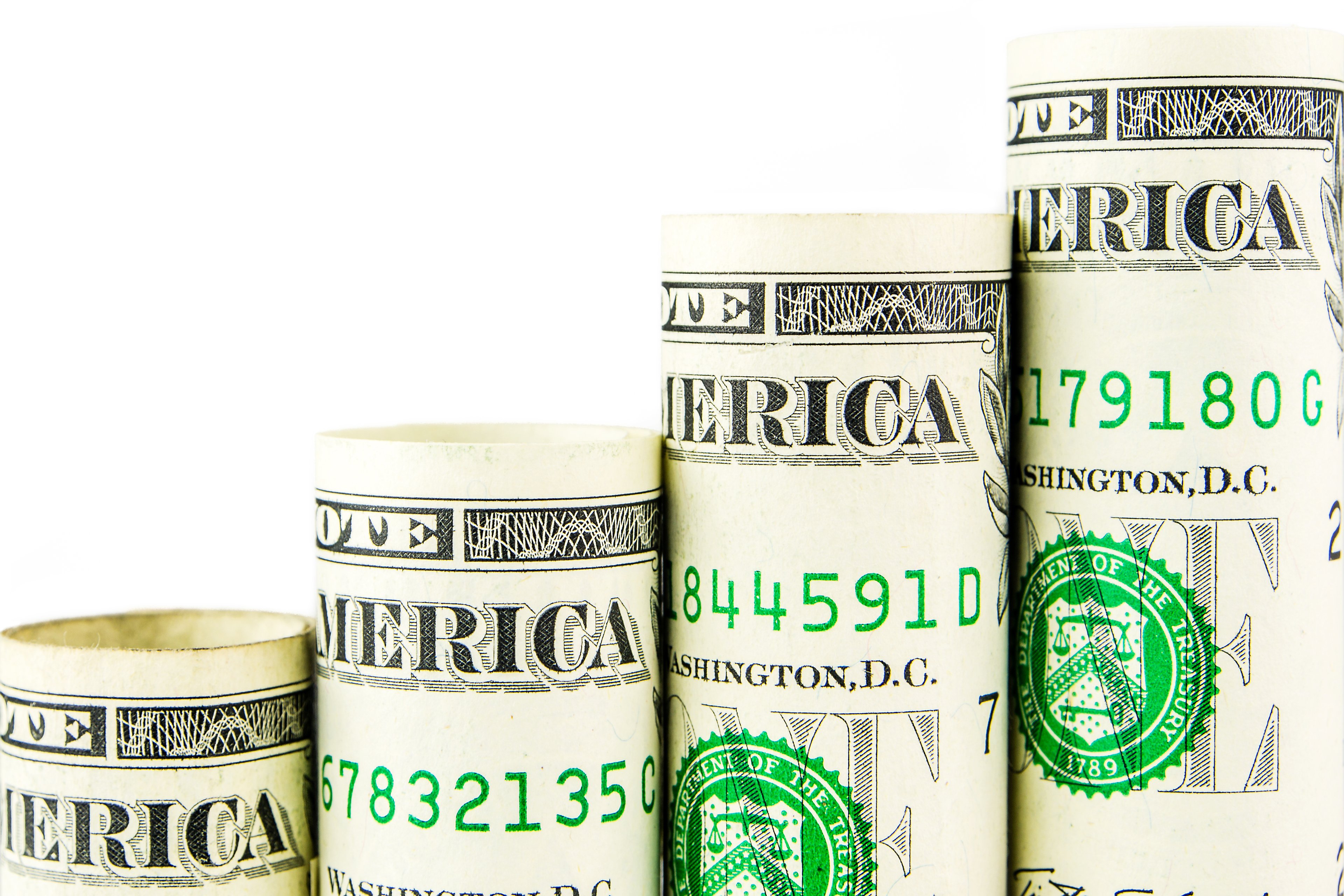 Stacks of money increasing in size.