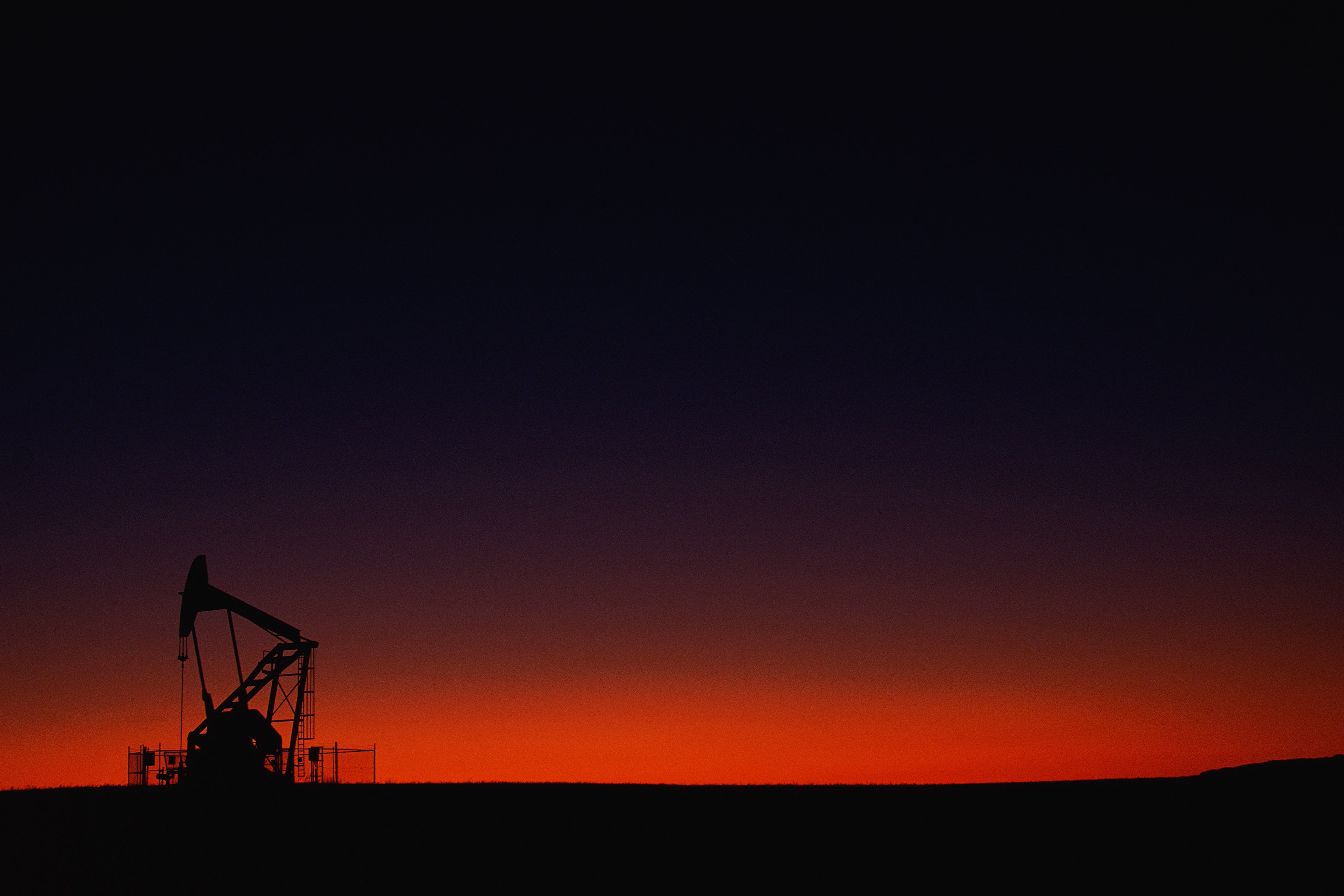 oil pumpjack at night