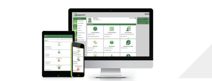 Computer screens displaying Paycom's interface.