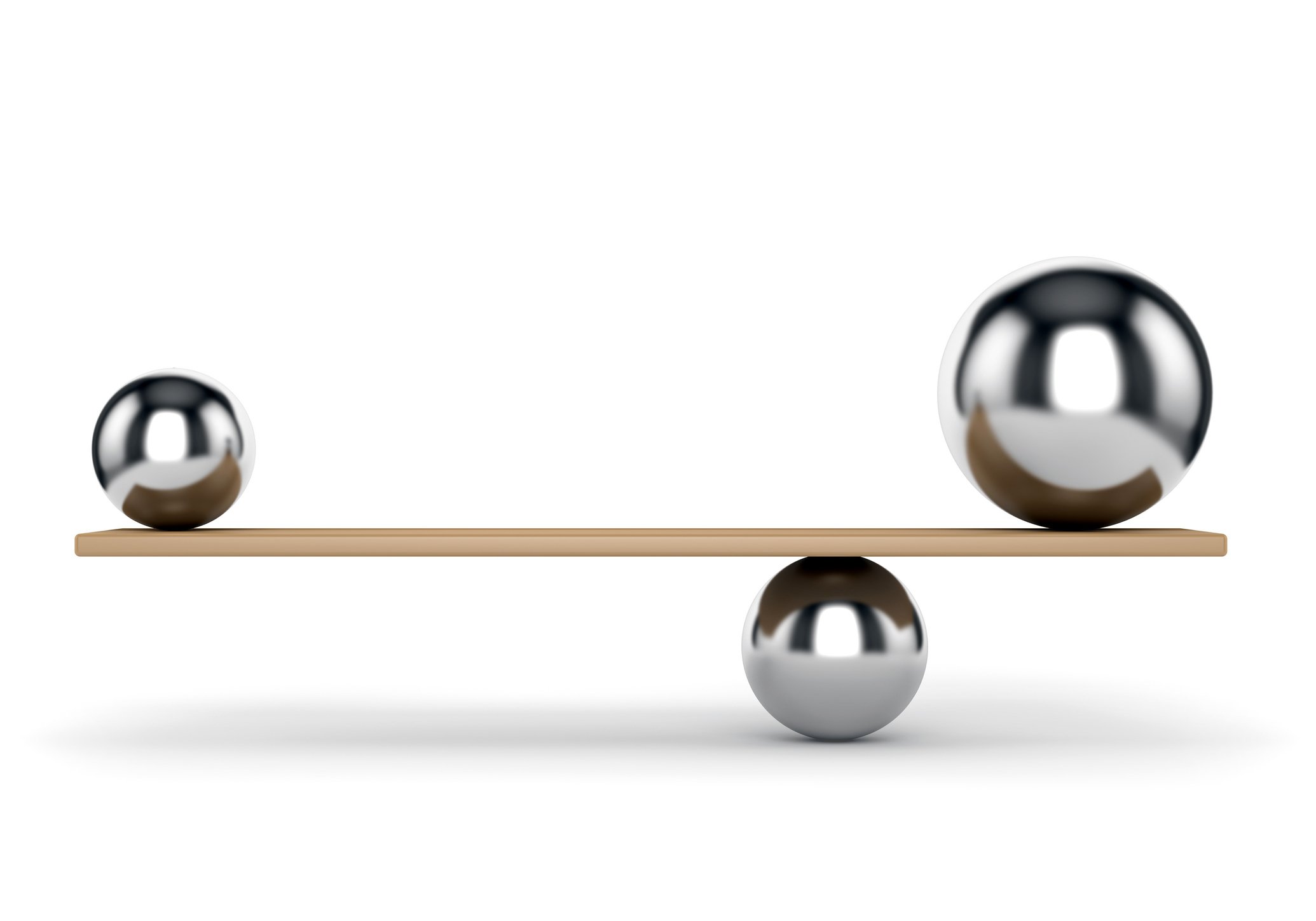 Metal balls balancing on plank