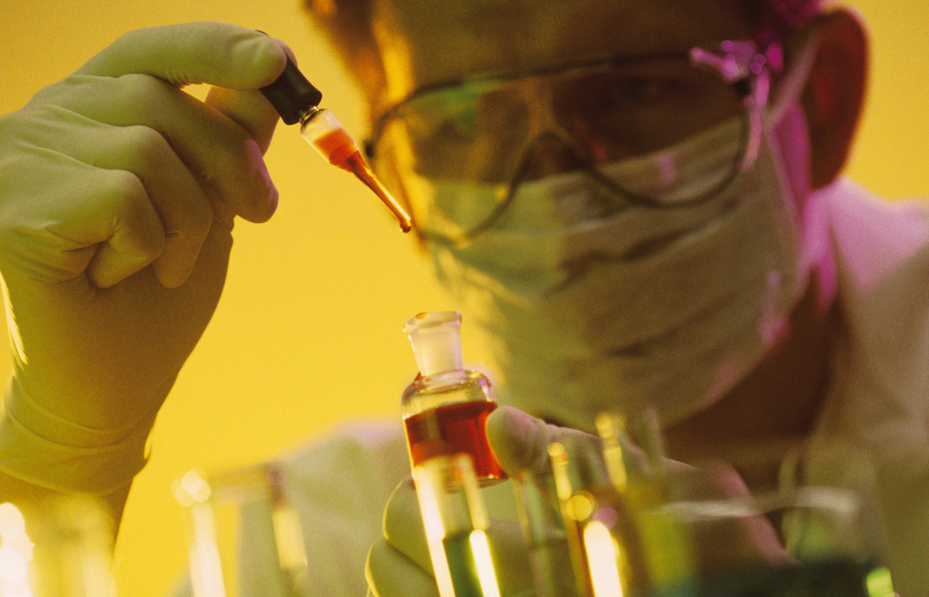 Biotech lab researcher with a test tube.