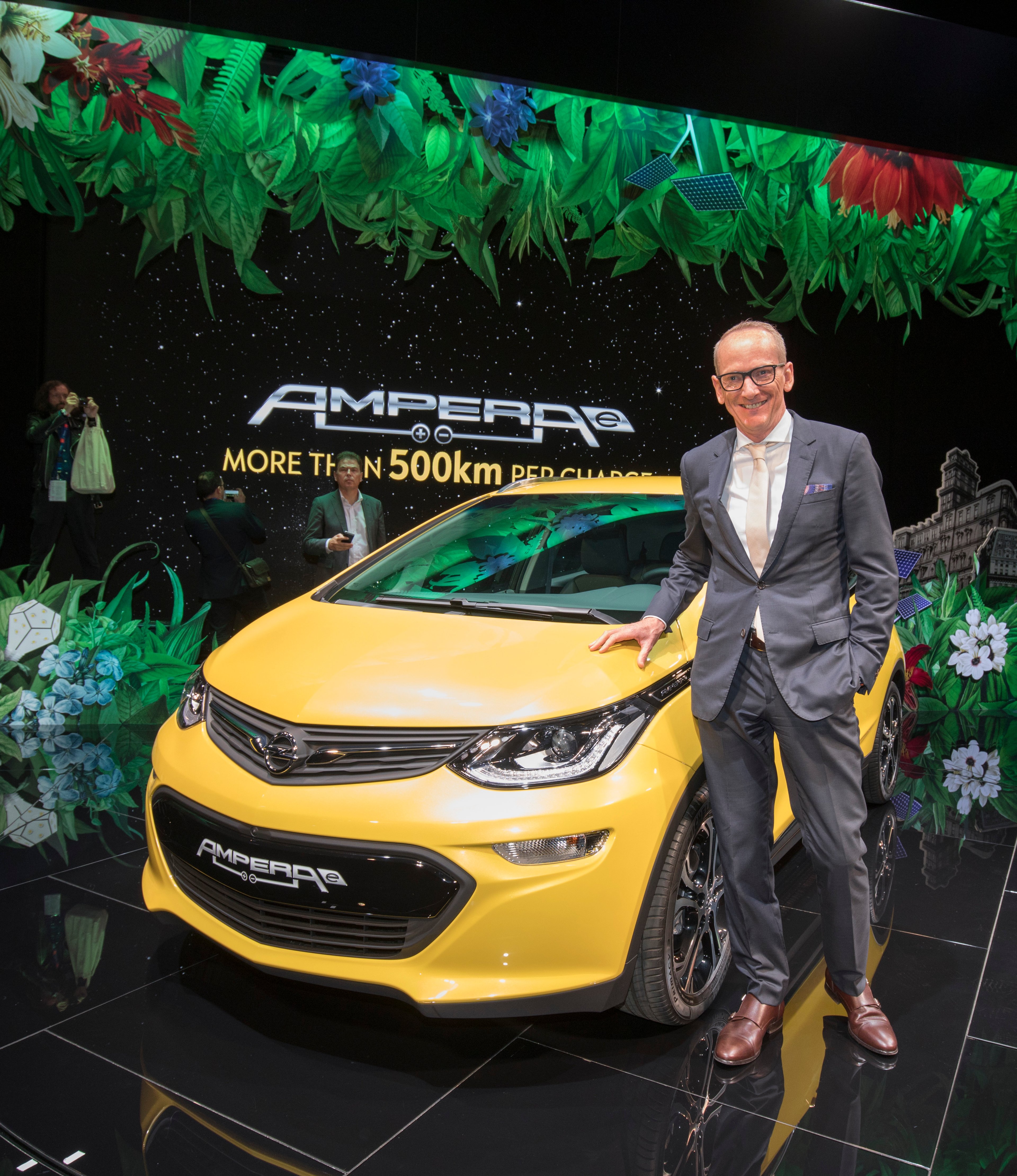 Opel CEO Karl-Thomas Neumann with an Opel Ampera-e electric car at the Paris Motor Show in October 2016. 