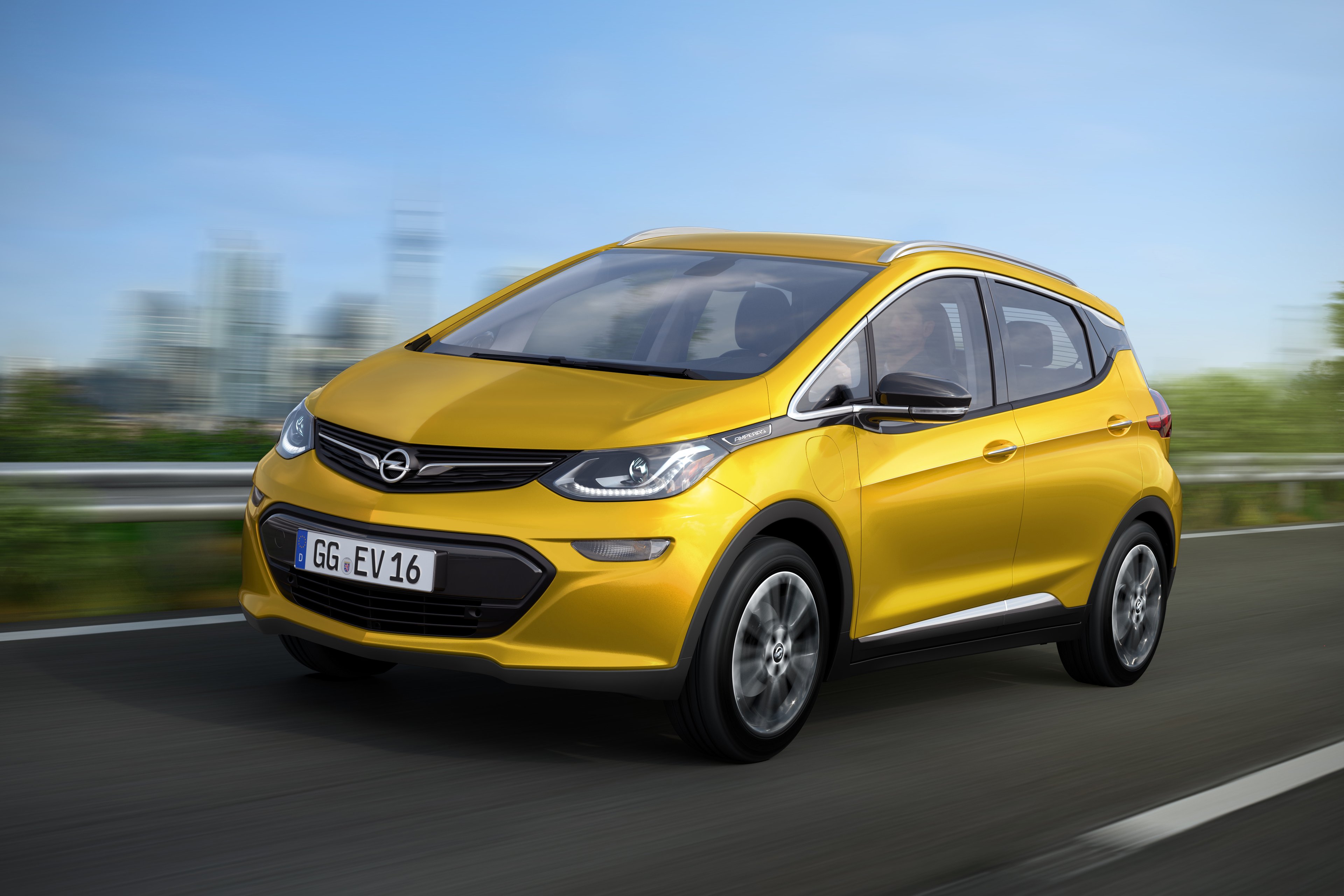 A yellow 2017 Opel Ampera-e on the road. 