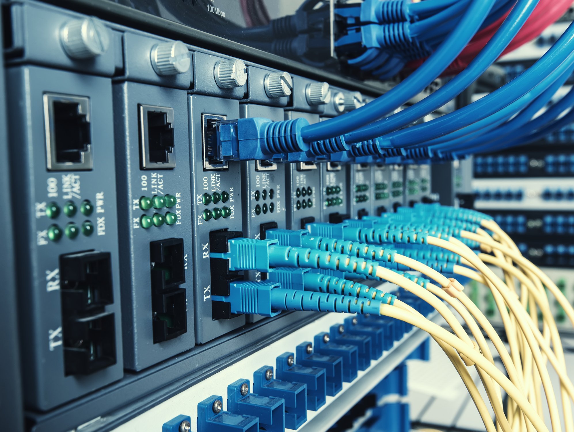 Wires plugged into a machine to provide internet access.