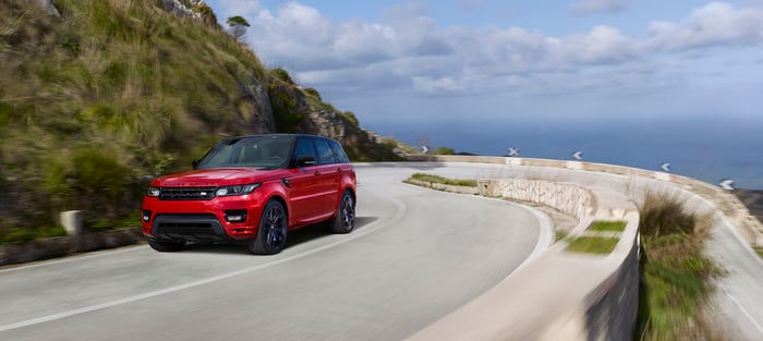 Image of JLR's Range Rover Sport driving on a highway.