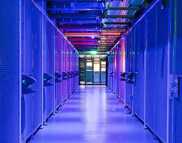 A data center corridor full of servers.