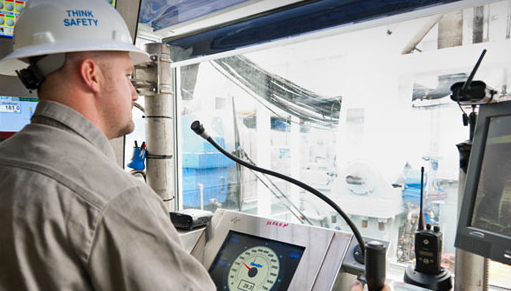 An image of a Helmerich and Payne employee working on a drill rig.