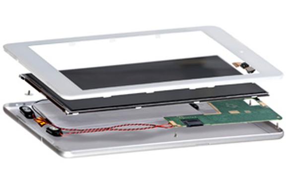 Three component layers of a tablet shown hovering above one another.