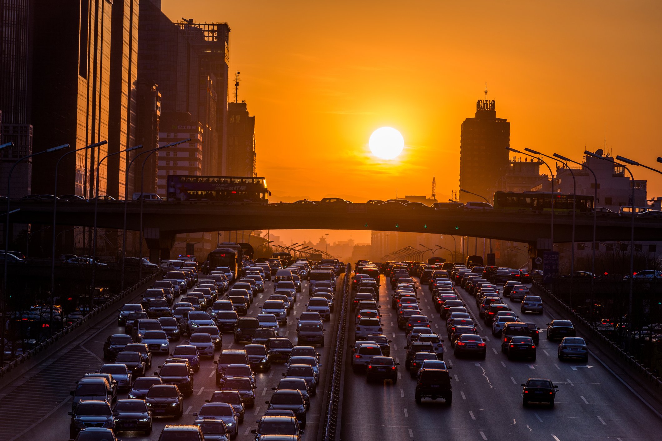 Sunset in Beijing over traffic jam.