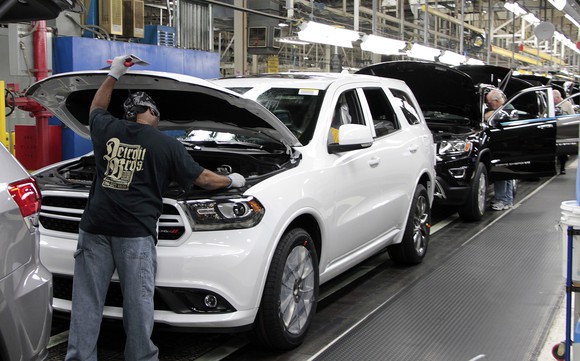 Dodge Durangos and Jeep Grand Cherokees on a factory assembly line.