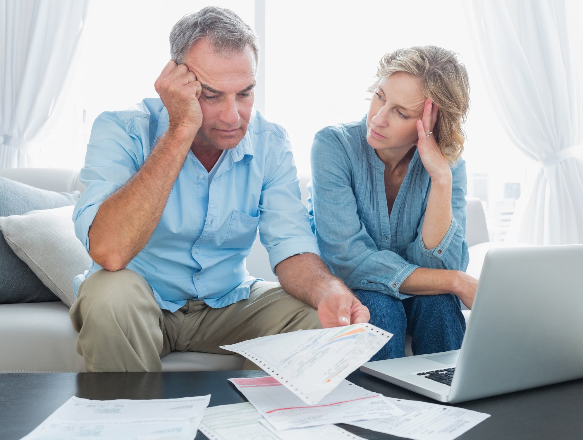Worried couple looking at finances