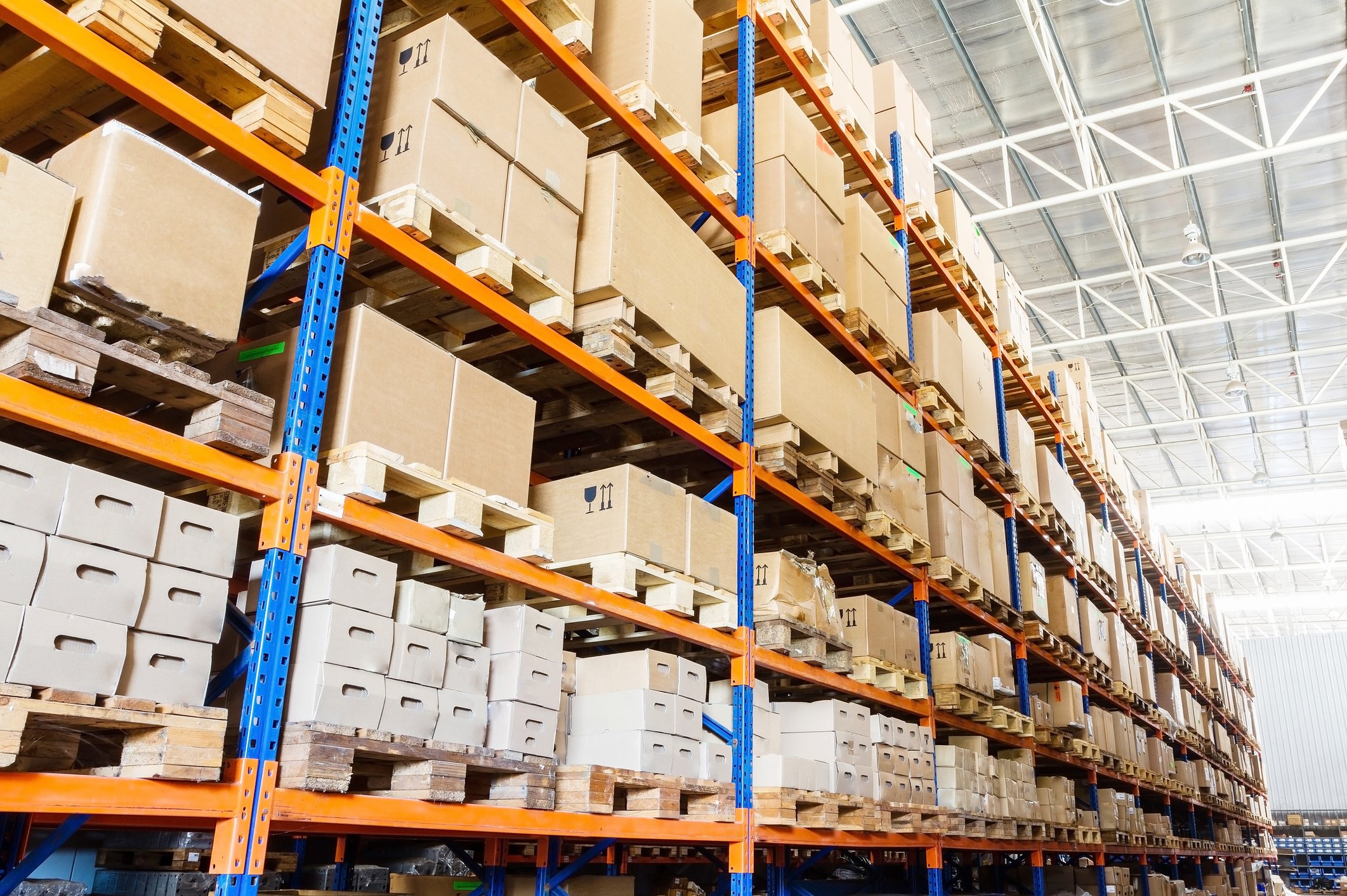 Boxes stored on racks in a warehouse.