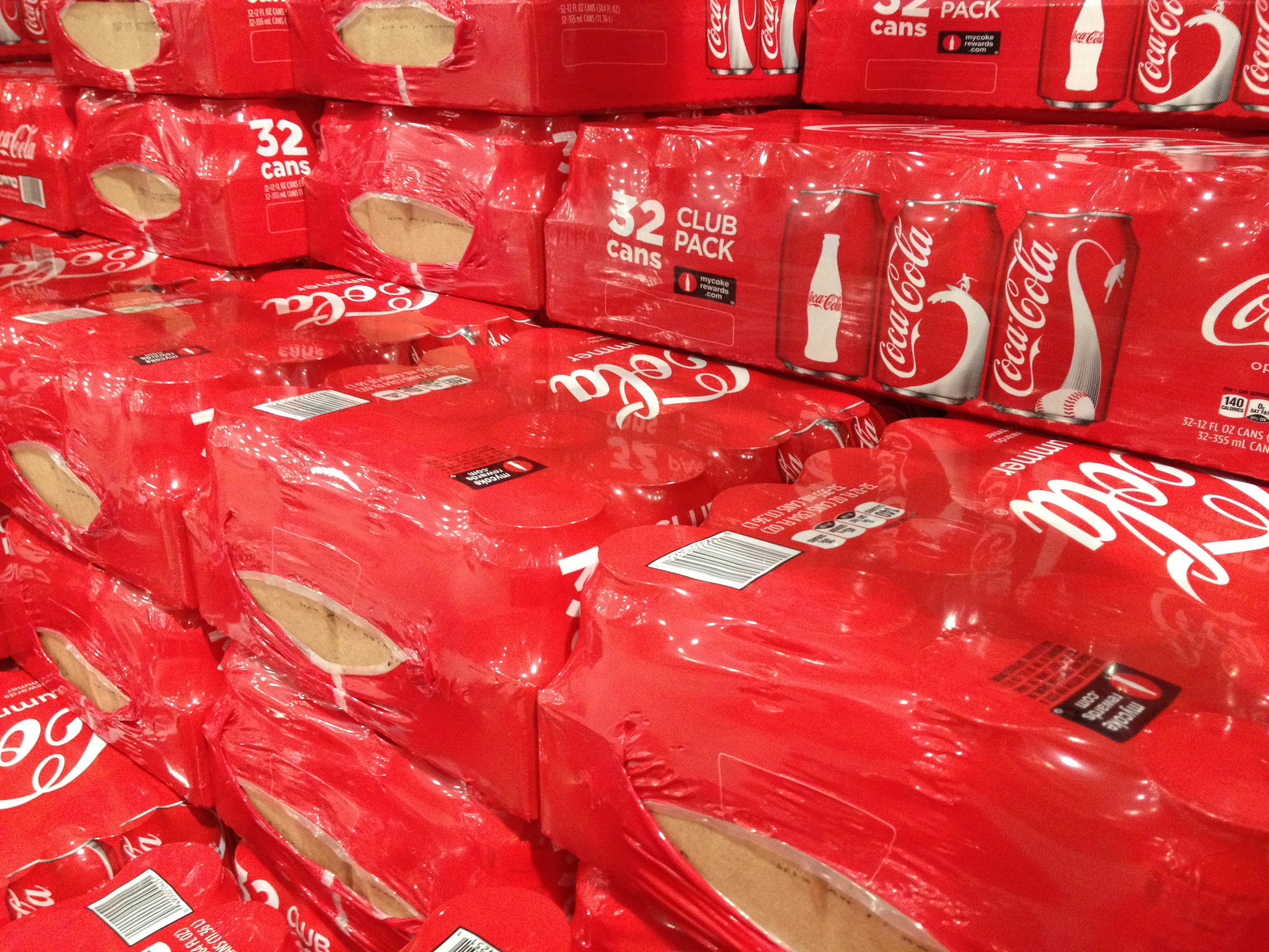 Stacks of cases of Coca-Cola cans