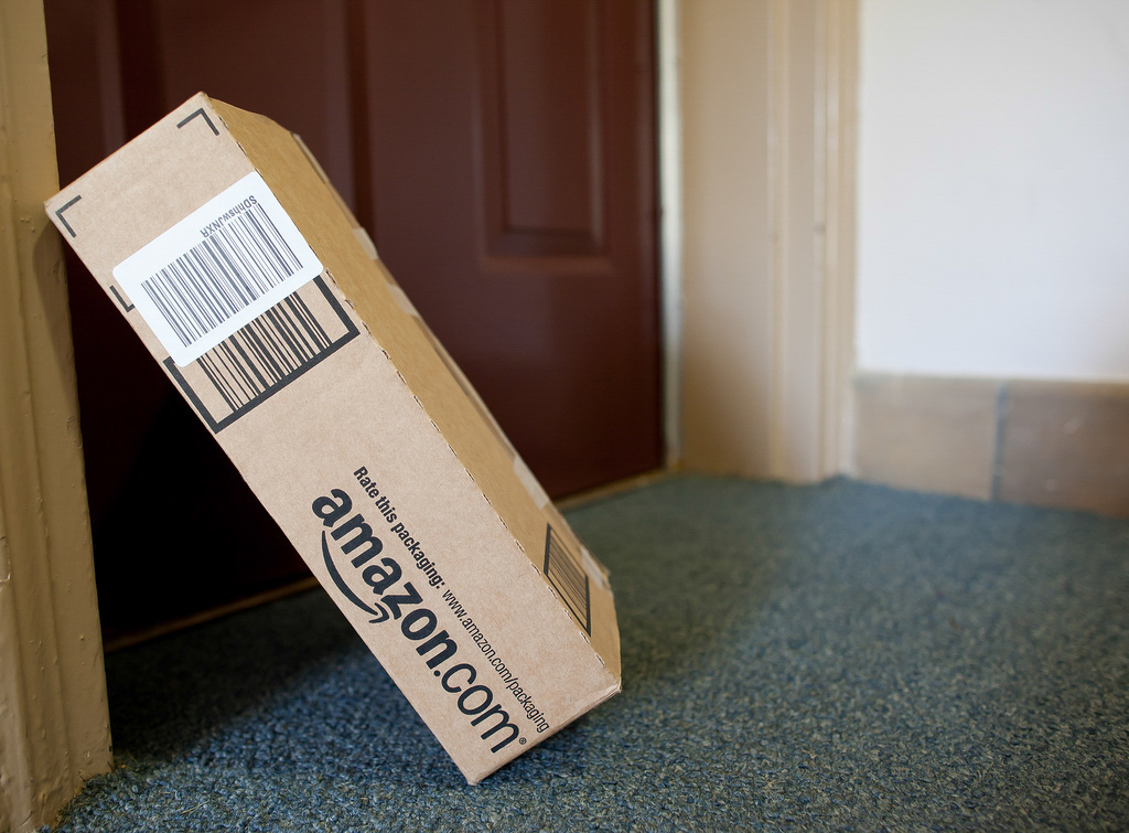 An Amazon package leaning against a door