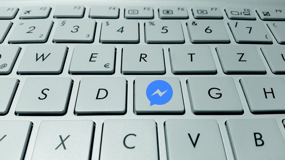 A keyboard with the Facebook Messenger icon replacing the F key.