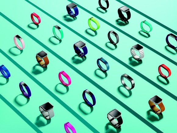 All of Fitbit's current products displayed in various colors.