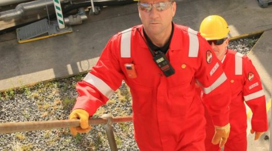 An image of Royal Dutch Shell employees walking up stairs.