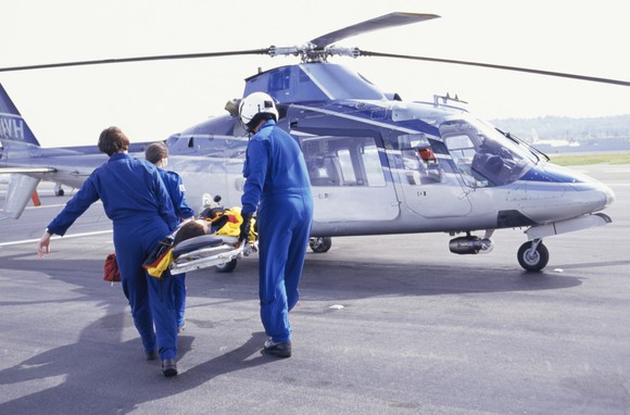 Medics loading patient into helicopter