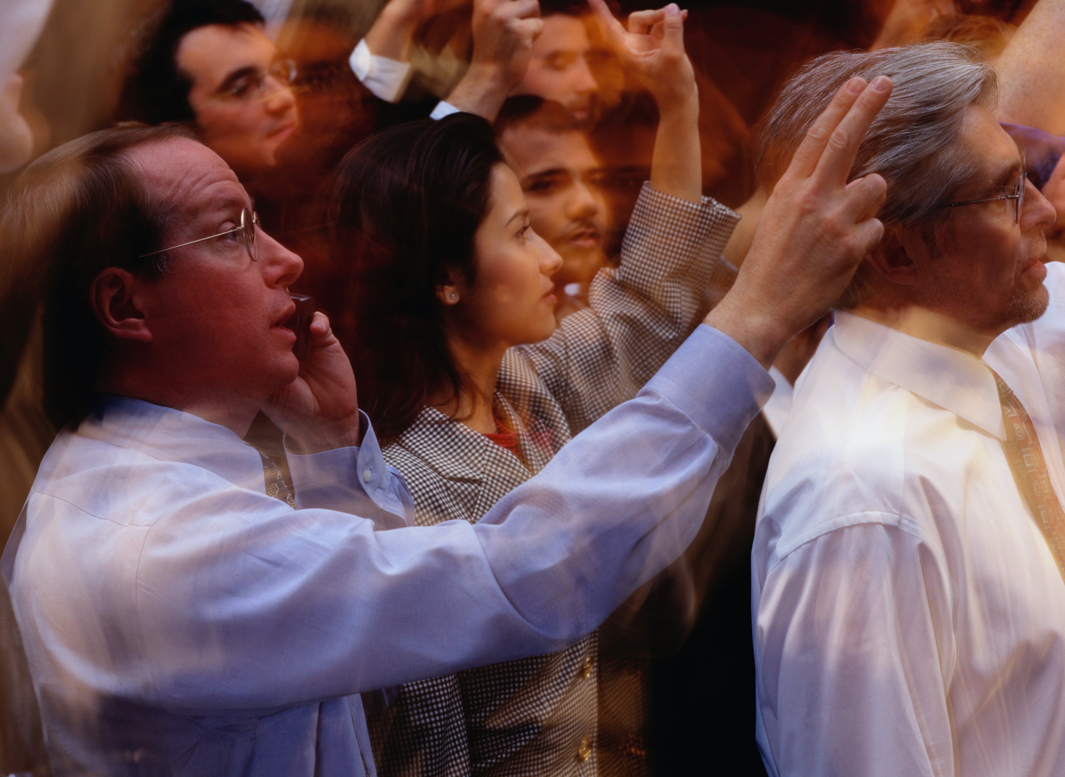 Stock brokers working on the floor of an exchange.