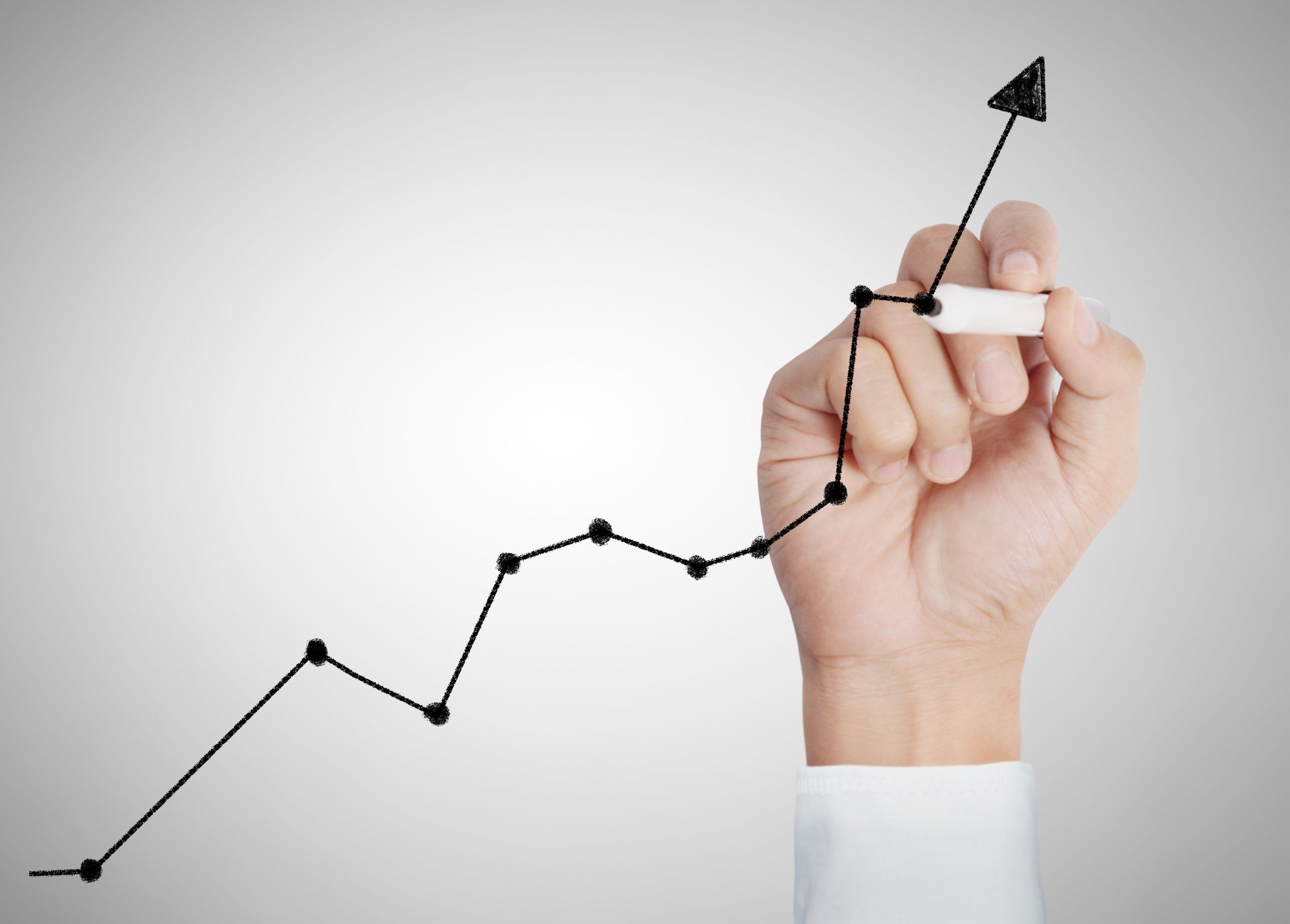 Hand drawing line graph going up