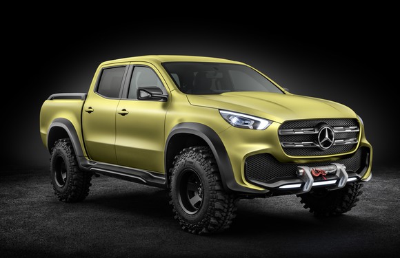A yellow Mercedes-Benz X-Class pickup with off-road equipment visible.