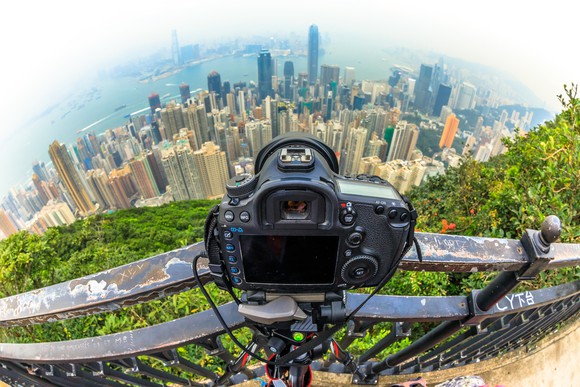A view of Hong Kong from behind a camera perched high in the sky.