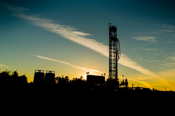 A drilling rig at sunset. 