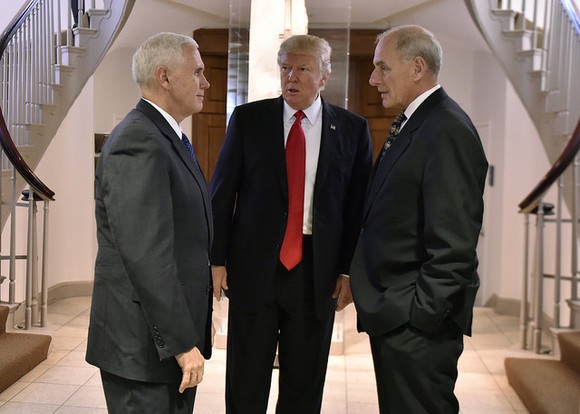 President Trump standing next to VP Mike Pence.