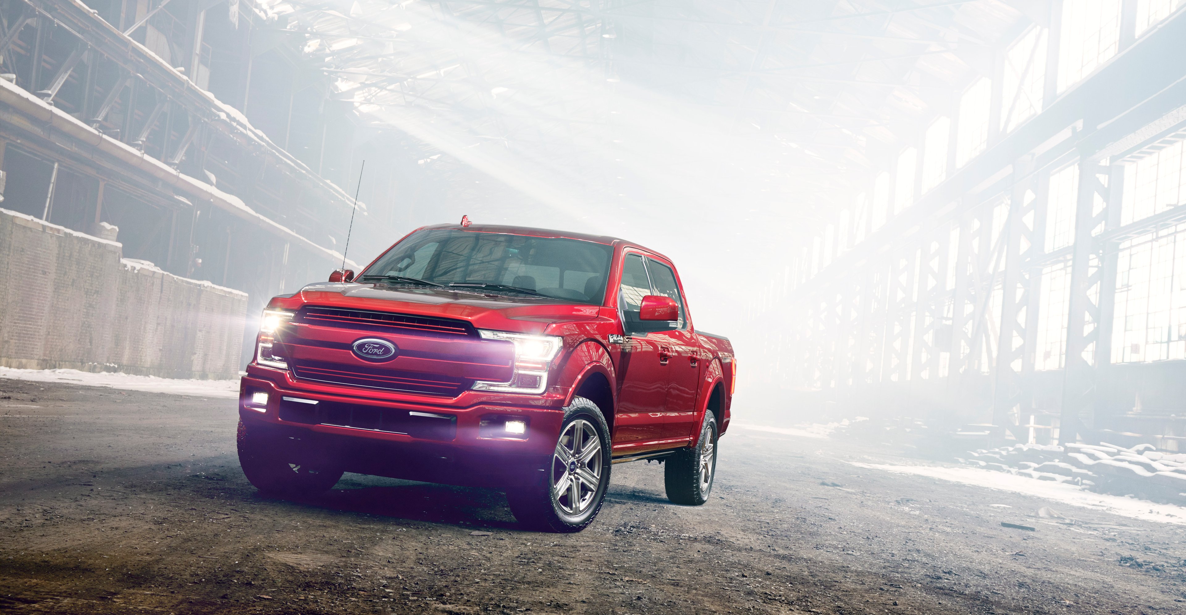 A red 2018 Ford F-150 pickup. 