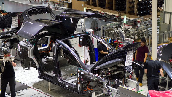 A partially assembled Model X moves down the assembly line at Tesla's Fremont, California factory.