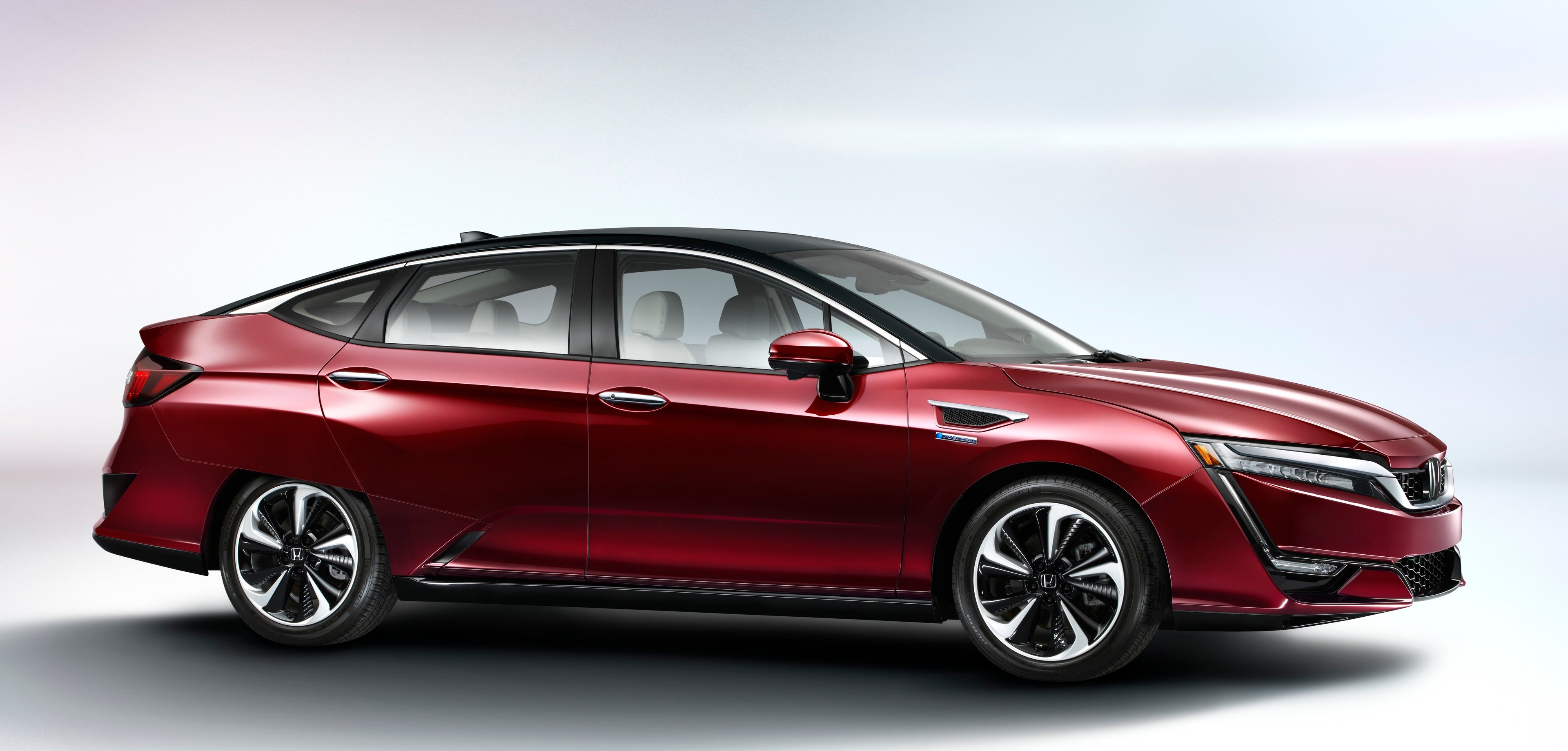 A red Honda Clarity Fuel Cell sedan. 