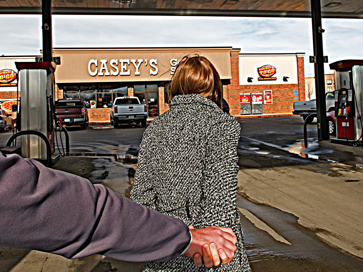 Man and woman walking towards a Casey's General Store