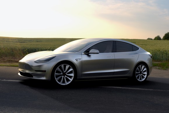 A silver Tesla Model 3 prototype. 