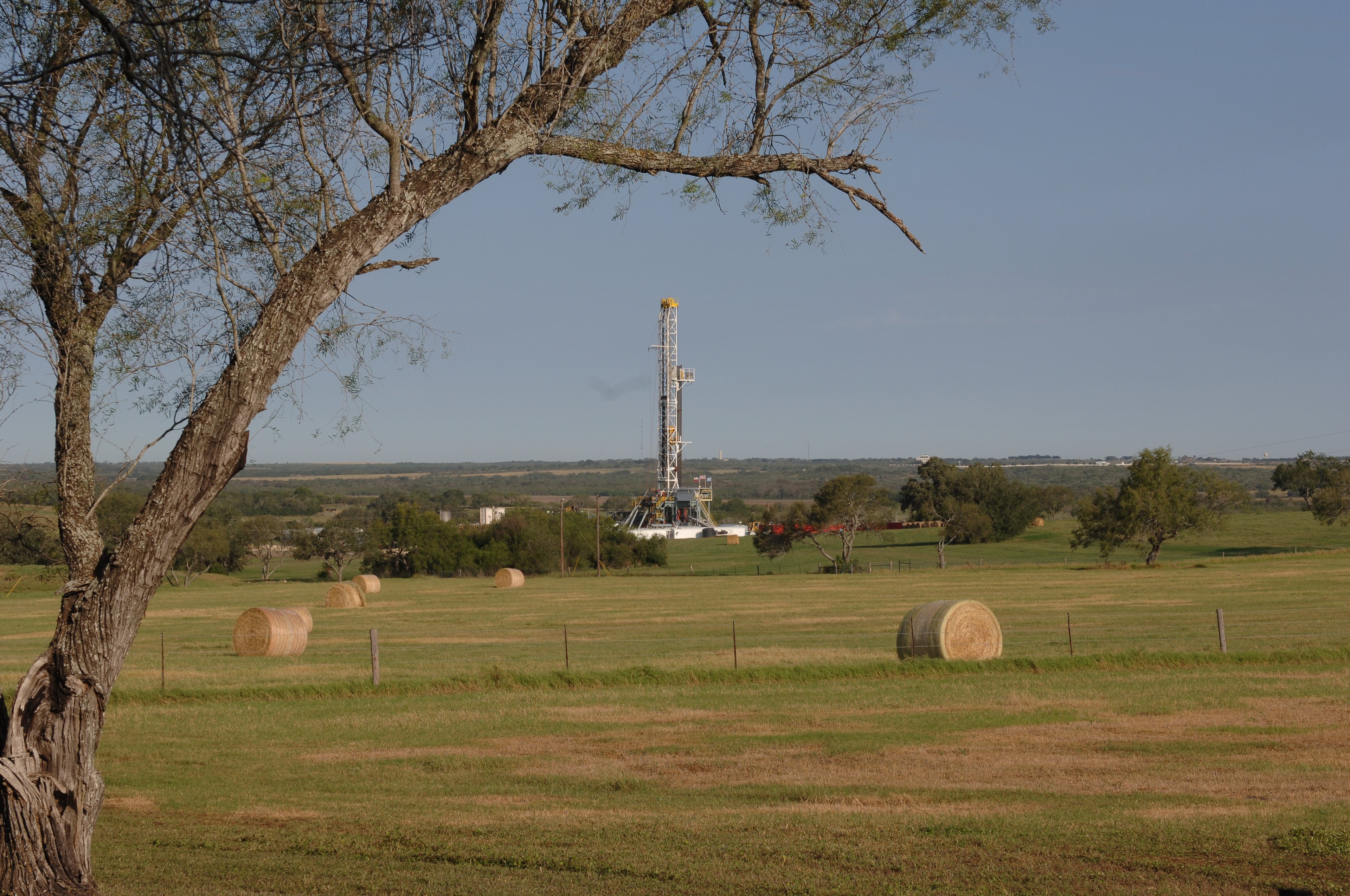 A drilling rig in a field. 