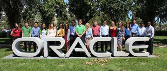 Oracle employees pose at HQ.