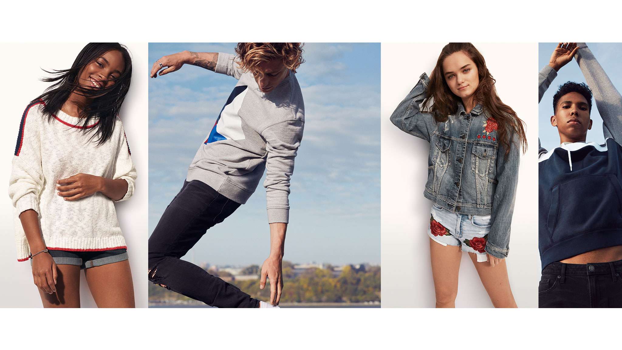 A group of young adults poses in American Eagle brand clothing.