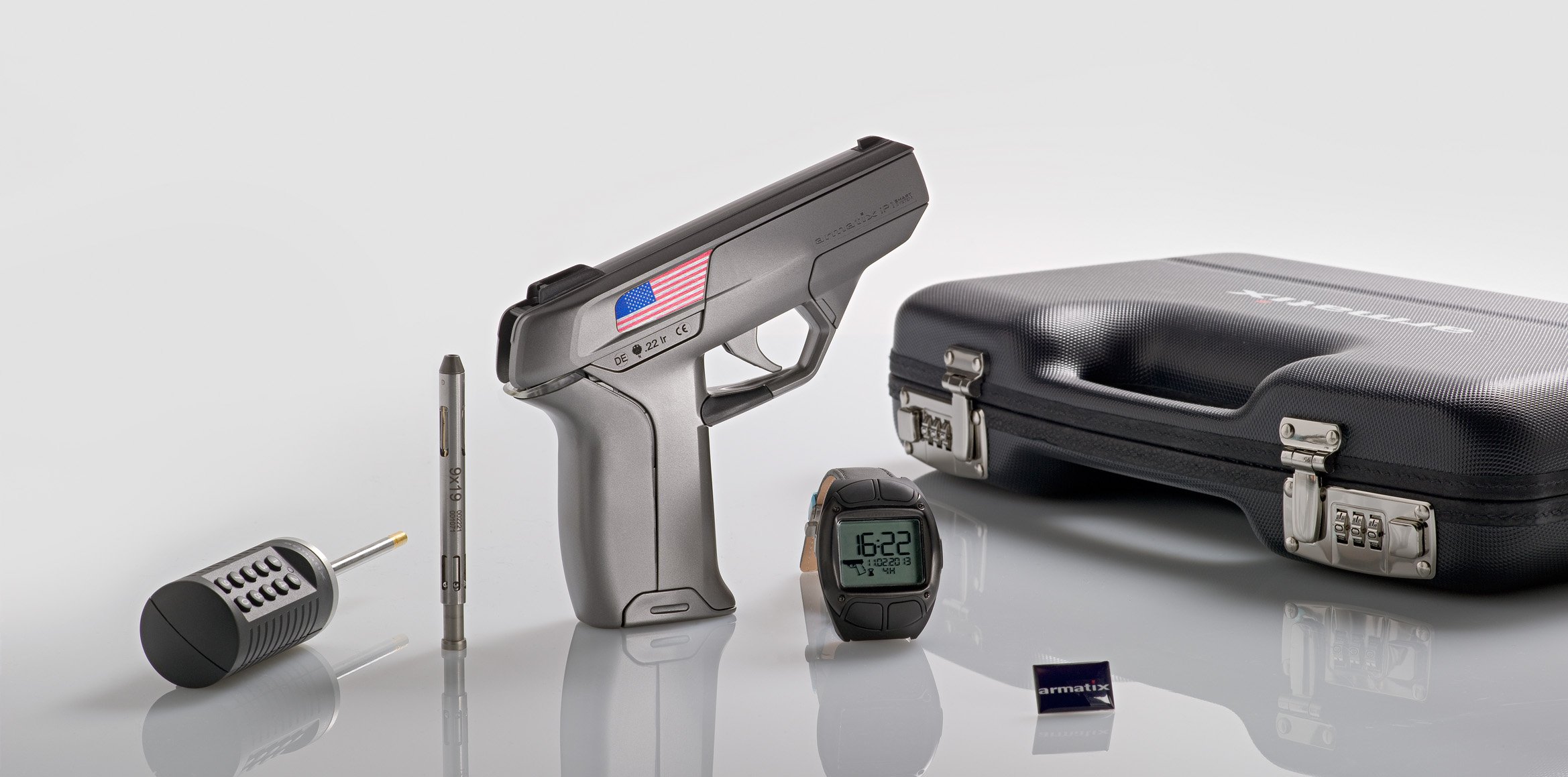 The Armatix iP1 system with smart gun, activating wrist band, locking mechanisms, and carrying case