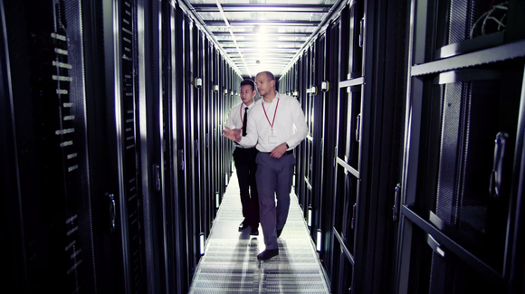 Two men walking in Nutanix' data center